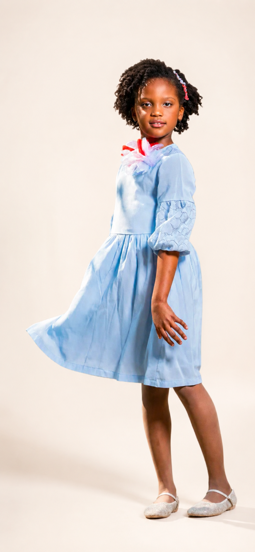 Elegant light blue a-line dress showcased on a young girl, perfect for various occasions and crafted with comfort and style.