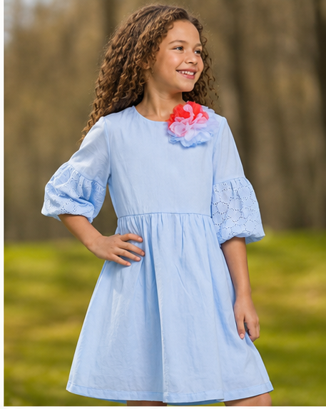 Elegant light blue a-line dress from Yotty Boutik, featuring puff sleeves and floral detail, perfect for kids&