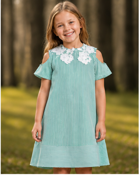 young girl smiling in a teal striped dress with lace detailing on the collar, standing in a forested area. verdant lace a-line dress
