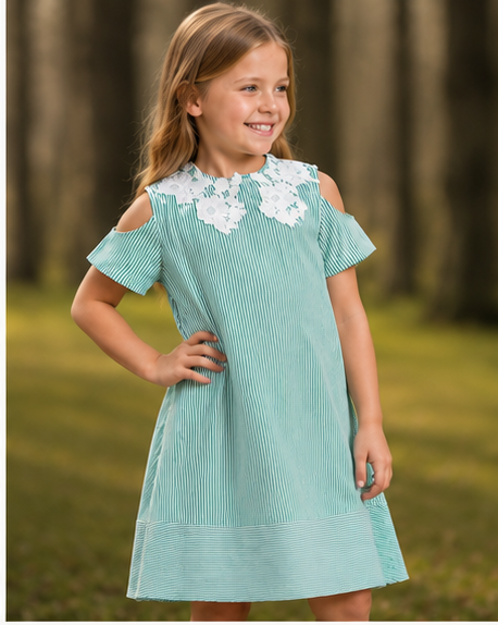 A girl smiling while wearing a stylish light blue dress with white lace detailing. verdant lace a-line dress on the collar, perfect for spring outings.